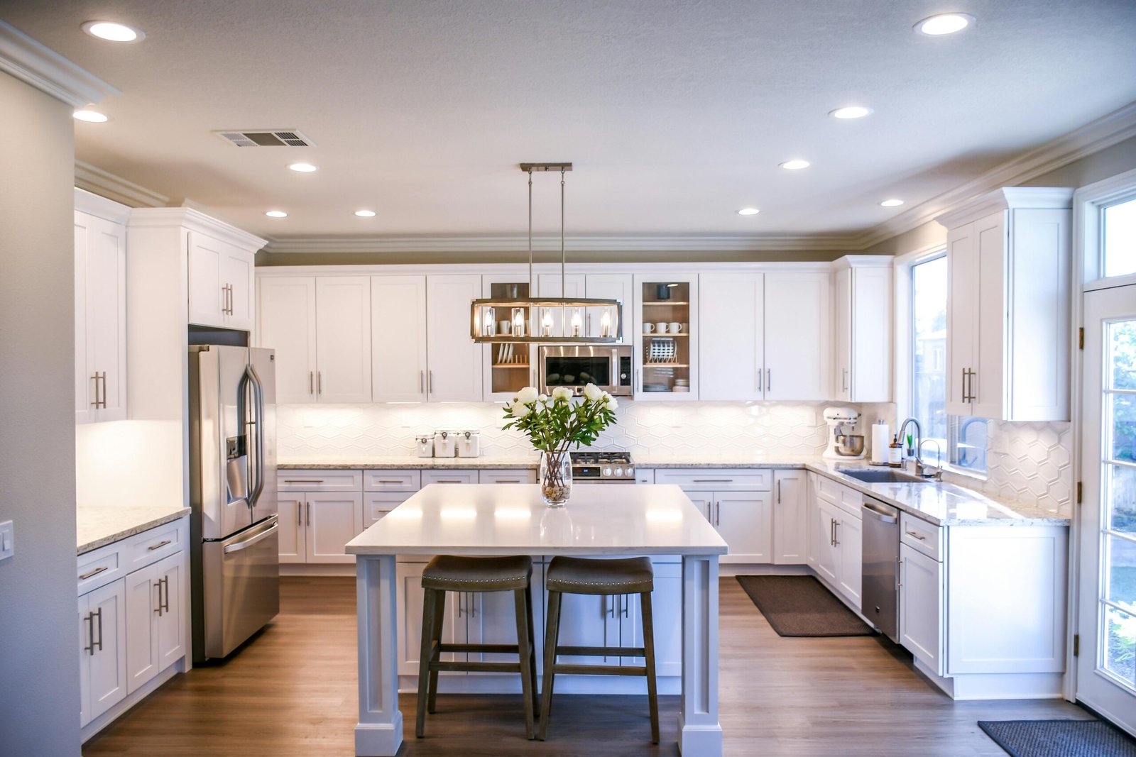 Tile backsplash with LED lighting and granite countertop in Roswell kitchen